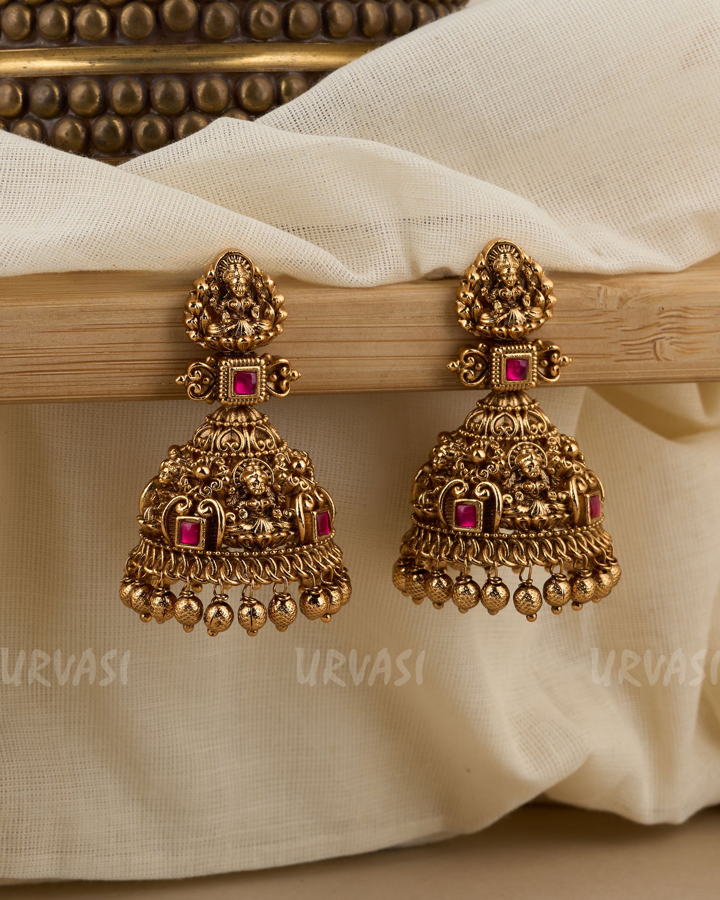 Antique Gold-Toned Lakshmi Floral Jhumka Earrings ER 405